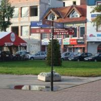 Inowrocław - Znak informacyjny na rynku, Grzegorz Binkiewicz